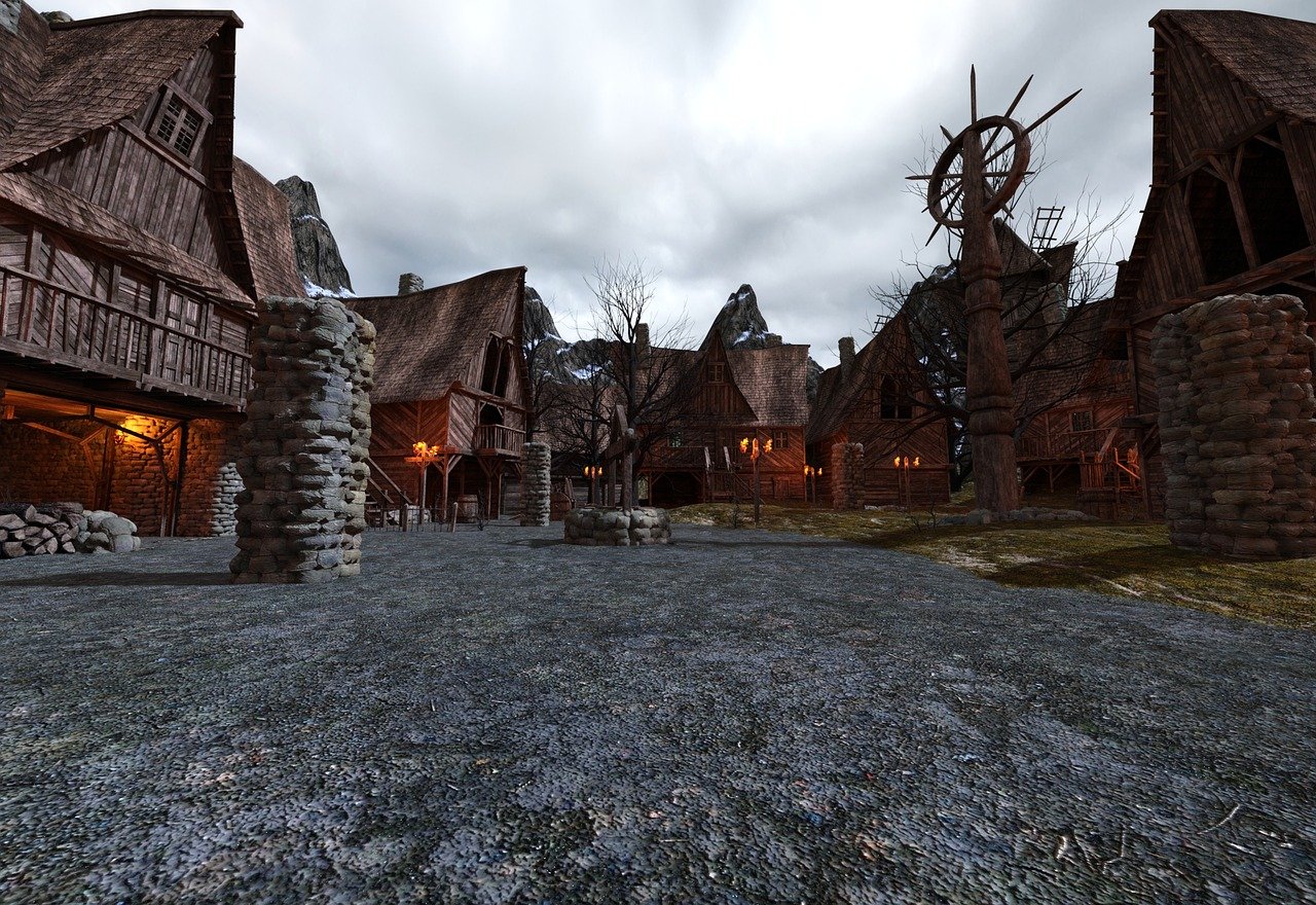 this image depicts a medieval village scene with stone and wooden buildings under an overcast sky. mountains are visible in the background. the village features cobblestone ground, bare trees, torches for lighting, stone pillars, a well, and a prominent wooden structure with a wheelshaped design. the scene evokes a sense of rustic fantasy architecture.
