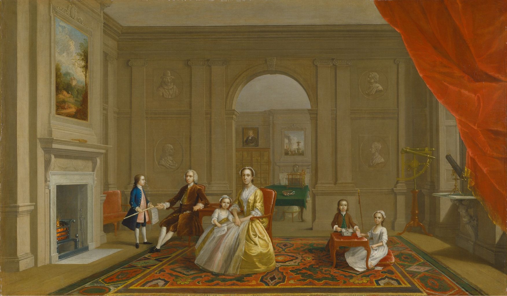 the image is a painting depicting a family scene in a grand interior. a man and woman are seated in chairs, with a young girl on the woman's lap. a boy stands near a fireplace with a stick, and two other children are seated at a small table playing cards. the room is decorated with busts, a painting above the fireplace, and a telescope in the corner. a red curtain partially covers the right side of the image. a rug covers the floor, and an arched doorway leads to another room.