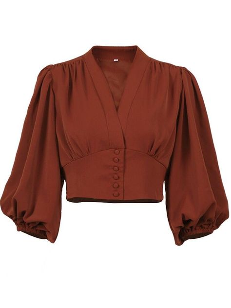 a closeup shot of a rustcolored women’s blouse on a white background. the long sleeve blouse features a vneck and cinched waist. content: blouse people:  environment:  lighting: studio lighting perspective: front kw: women's fashion, top, shirt, vneck, button up, rust, fall fashion, long sleeve, cinched waist, puff sleeve