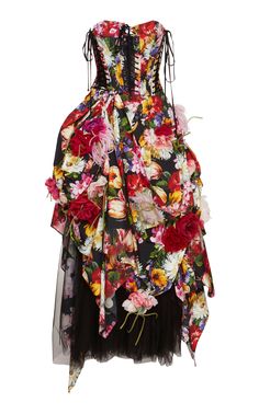 a strapless black tulle cocktail dress with a fitted floral print bodice and a voluminous ruched skirt. the dress is designed with a layered, asymmetrical silhouette and features a laceup corset detail. it's a luxurious and feminine design perfect for a special occasion.