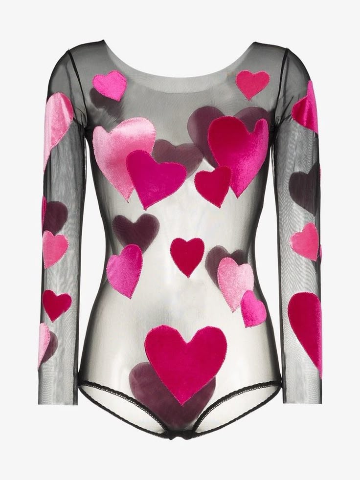 a sheer black bodysuit with long sleeves is adorned with pink and deep magenta velvet hearts. the hearts are of various sizes and are scattered across the body and sleeves of the garment. the bodysuit has a low, round neckline and black trim around the edges.