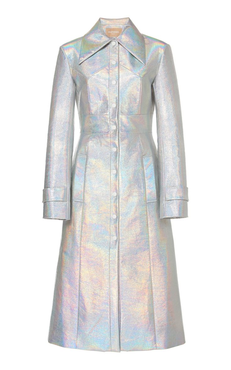 a silver, iridescent, longsleeved dress with a collar, pockets, and button up front. the dress is flowy and casual,  but also elegant and sophisticated. it is a great piece for a variety of occasions, from daytime outings to evening events.  the dress is made of a highquality fabric and is wellconstructed. it is a beautiful and stylish piece that is sure to turn heads.