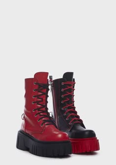 a pair of platform boots, one red with black laces and one black with red laces, are placed side by side on a white background. they are both lace up and have a zipper on the inside of the ankle. the red boot has a chunky platform sole while the black boot has a thinner platform sole.
