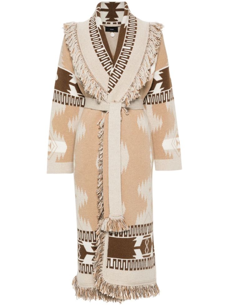 this is a long beige cardigan with a shawl collar, fringe details, and a geometric pattern in brown and white. it has a tie belt and long sleeves. the cardigan is made of a comfortable knit fabric and is perfect for the fall and winter seasons. it can be styled casually or dressed up for a more elegant look.
