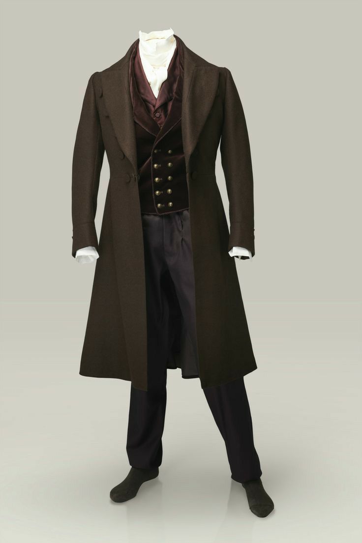 the image shows a formal men's outfit consisting of a long brown coat, a vest, trousers, and shoes. the coat is doublebreasted and the vest has several rows of buttons. a white shirt is visible under the vest. the trousers are black, and the shoes are also black. the outfit is displayed on a mannequin or stand, with a plain background.