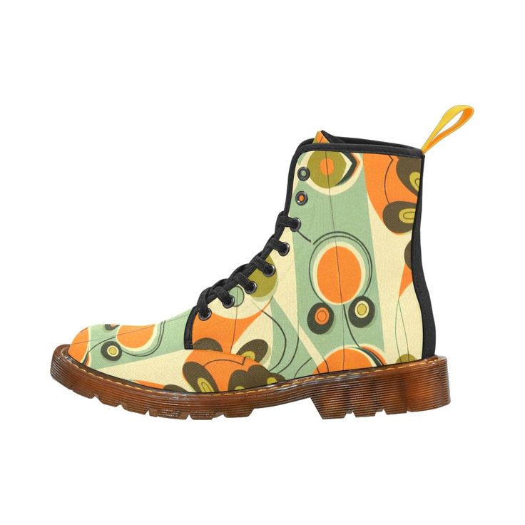 a pair of women's ankle boots with a colorful retro pattern on them. the boots are black leather with a brown sole and laces. the pattern is abstract and features various shapes in shades of orange, green, and brown.