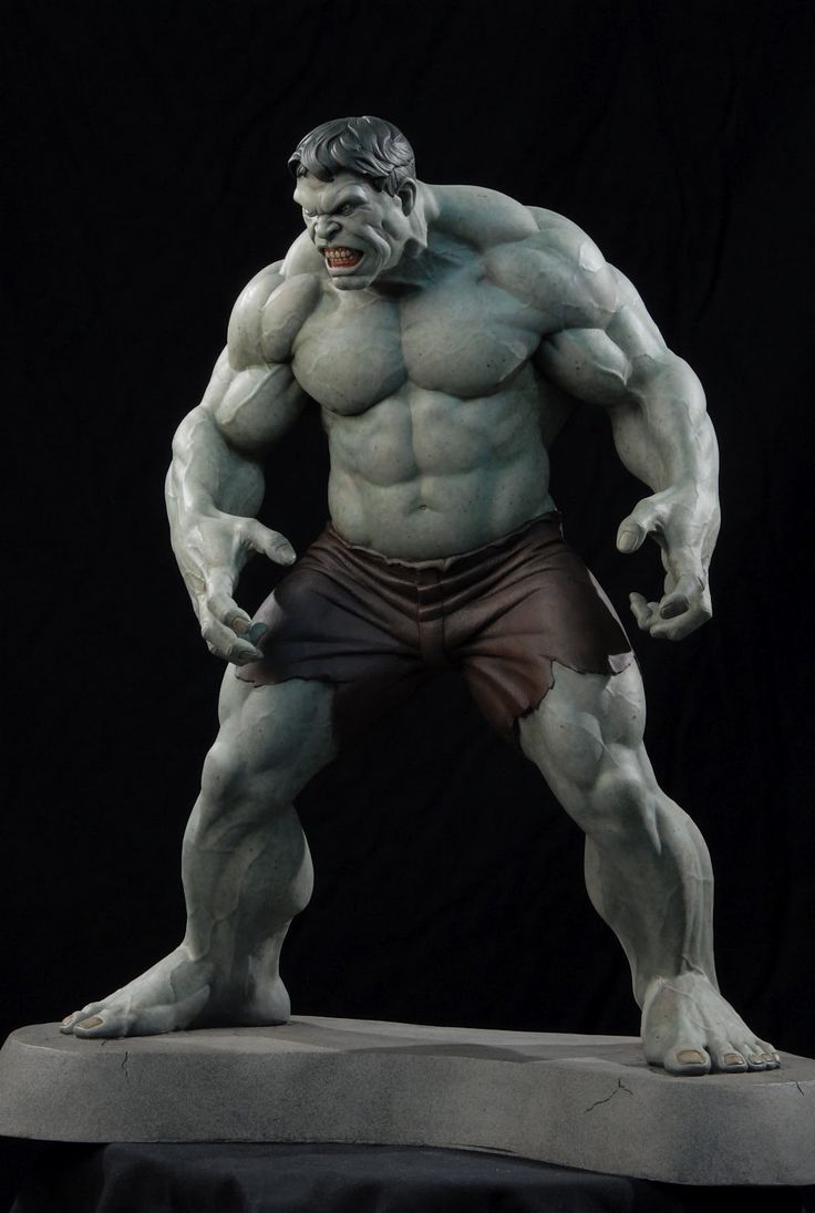 a sculpted statue of the hulk, a popular marvel superhero, is captured in a menacing pose.  his green skin is highlighted with gray to accentuate his powerful muscles.  he stands on a simple base against a black background. the lighting is dramatic, coming from above and slightly in front of the figure to emphasize his rage.