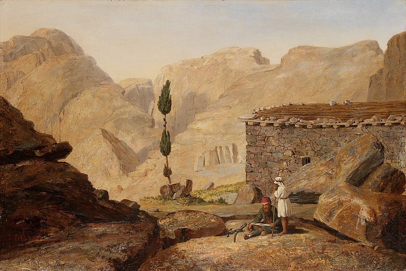 the painting depicts a desert landscape with large rock formations and a stone building on the right. two figures stand outside the building, one sitting on a rock with a weapon next to him, and the other standing beside him. two thin trees stand in the middle ground, and mountains rise in the background under a hazy sky.