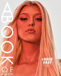 the image is a book cover featuring loren gray. she has blonde hair and is wearing makeup. the title of the book is "a book of". the cover is labeled "digital cover". her name is written on the bottom right.