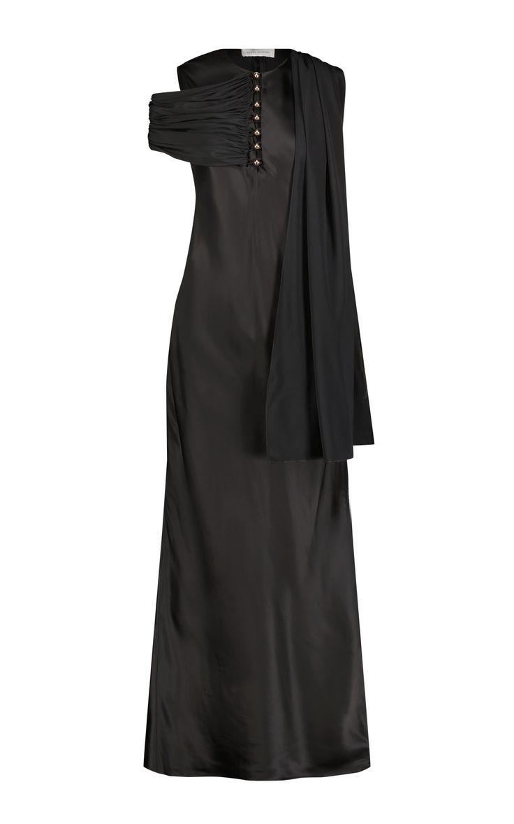 a black silk dress with a cowl neck and one shoulder. the dress is long and has a flowing skirt. it is a sophisticated and elegant dress that would be perfect for a formal event.