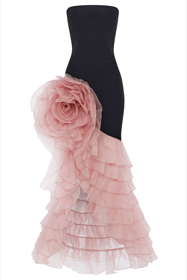 a strapless black evening gown with a large pink rose on the hip, and a cascading ruffle skirt.