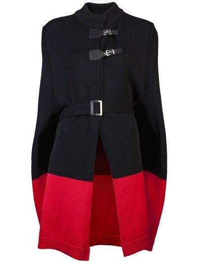 a black and red coat with a high collar, sleeveless design, a belt, and buckle closures.