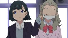two anime girls stand close together. the girl on the left has short dark hair and blue eyes. she wears a navy blue school uniform jacket over a white buttondown shirt and a grey sweater vest. she gazes at the camera with a neutral expression. the girl on the right has short, wavy blonde hair and closed eyes. she wears a pink school uniform jacket with a red bow and a white undershirt. she is smiling, with a white surgical mask covering her mouth. the left girl holds the ear loops of the mask as if to remove it. they are framed against a backdrop of a window and a pale blue wall.