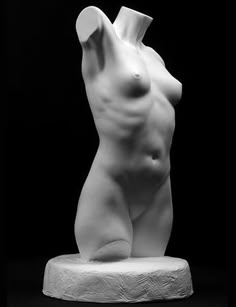 a white plaster statue of a female torso. the statue is positioned on a white pedestal. the statue is a minimalist piece of art with smooth curves and detailed anatomical features.  it appears to be a modern or contemporary sculpture.