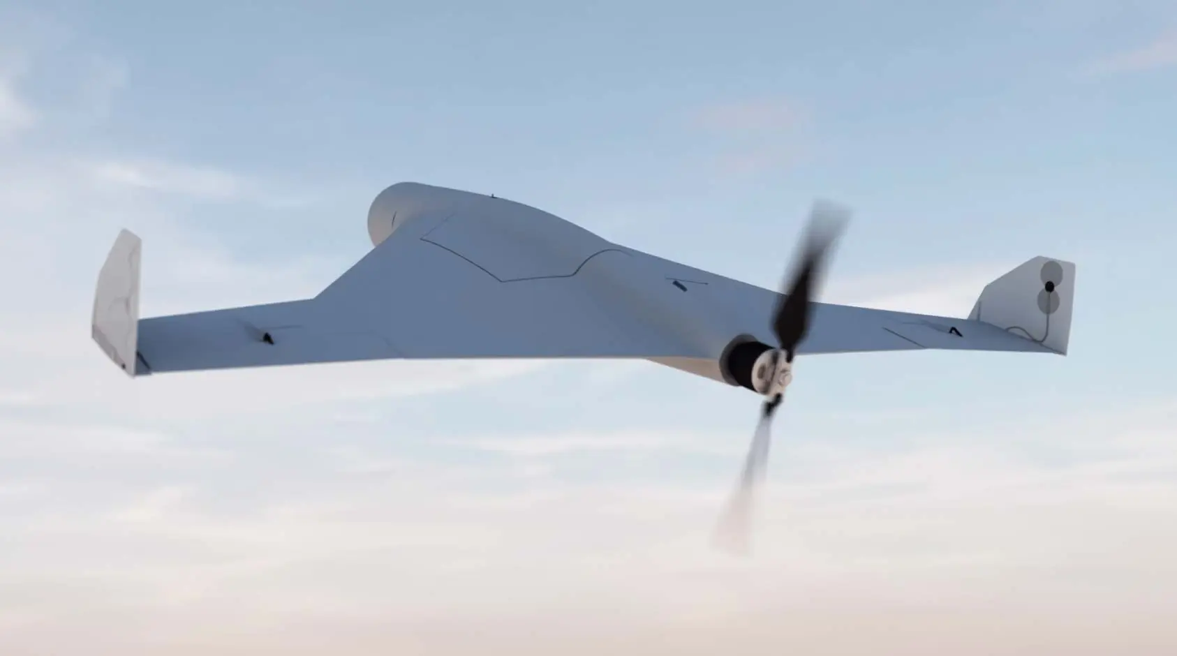 a white drone with a propeller is flying through a cloudy sky.