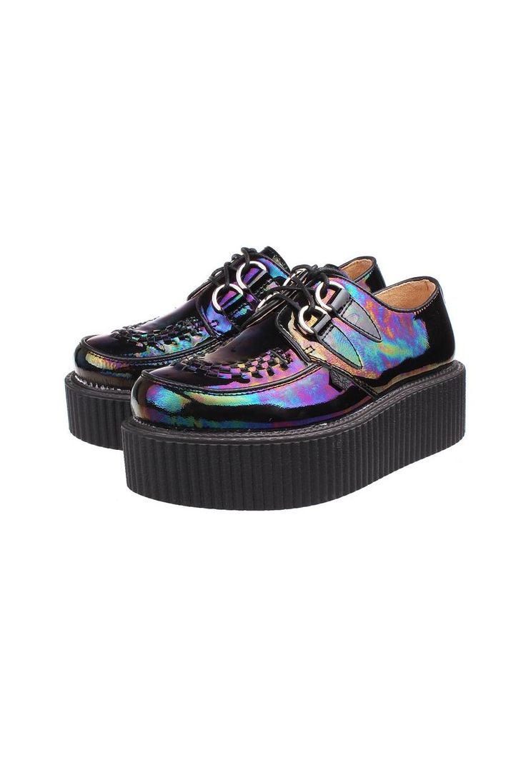 a pair of iridescent black platform creeper shoes are shown on a white background. the shoes are laced and have a thick, black platform sole. the uppers are iridescent, reflecting multiple colors.