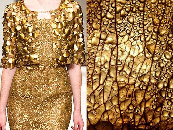 the image shows a woman wearing a gold dress adorned with sequins and a gold leaf texture. the dress is very sparkly and looks elegant and glamorous. the leaf texture is macro and closeup which gives a natureinspired feel to the image. both the dress and the leaf texture have a metallic sheen. the image is an abstract and artful representation of gold.