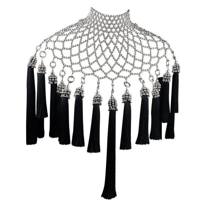 a silver beaded net necklace with black tassel fringe. the necklace has a high collar and is made of a mesh of small silver beads. dangling from the bottom of the necklace are multiple black tassels, attached with ornate silver caps and links.