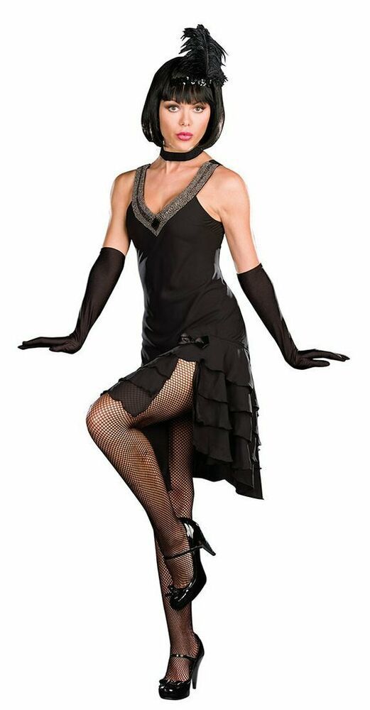 a young woman dressed up in a flapper costume. she is wearing a black dress with feathers, gloves, and shoes. she also has fishnet stockings. she is posing for a photo.