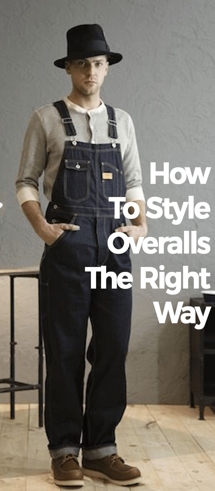 a man is wearing overalls, a hat, and boots. he is standing in a casual pose. the text "how to style overalls the right way" is superimposed on the image.