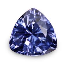 a trillioncut blue sapphire gemstone, illuminated with studio lighting. the gem displays a deep blue hue with intricate facets that reflect the light, showcasing its brilliance and clarity.
