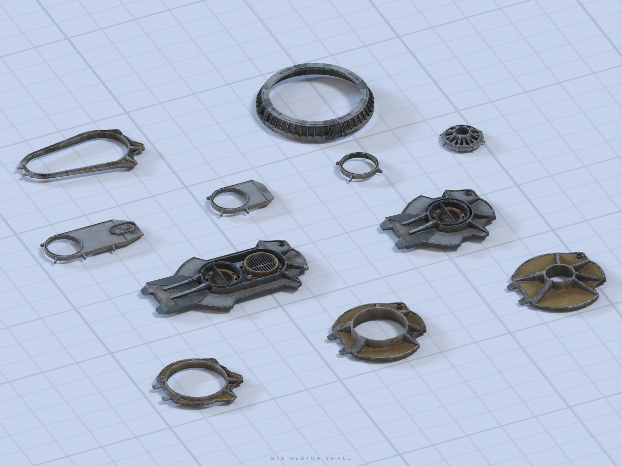 the image shows a collection of various 3dprinted or rendered metallic parts laid out on a gridded surface. the parts appear to be mechanical components of different sizes, with some showing internal structures. the parts are various shapes: circular, rectangular, and more complex forms.  the overall color scheme is muted grey and the parts have a textured metallic look. the image includes a caption "big medium small" indicating the different sizes of the components represented. the background is a light grey grid, suggesting a design or engineering workspace.
