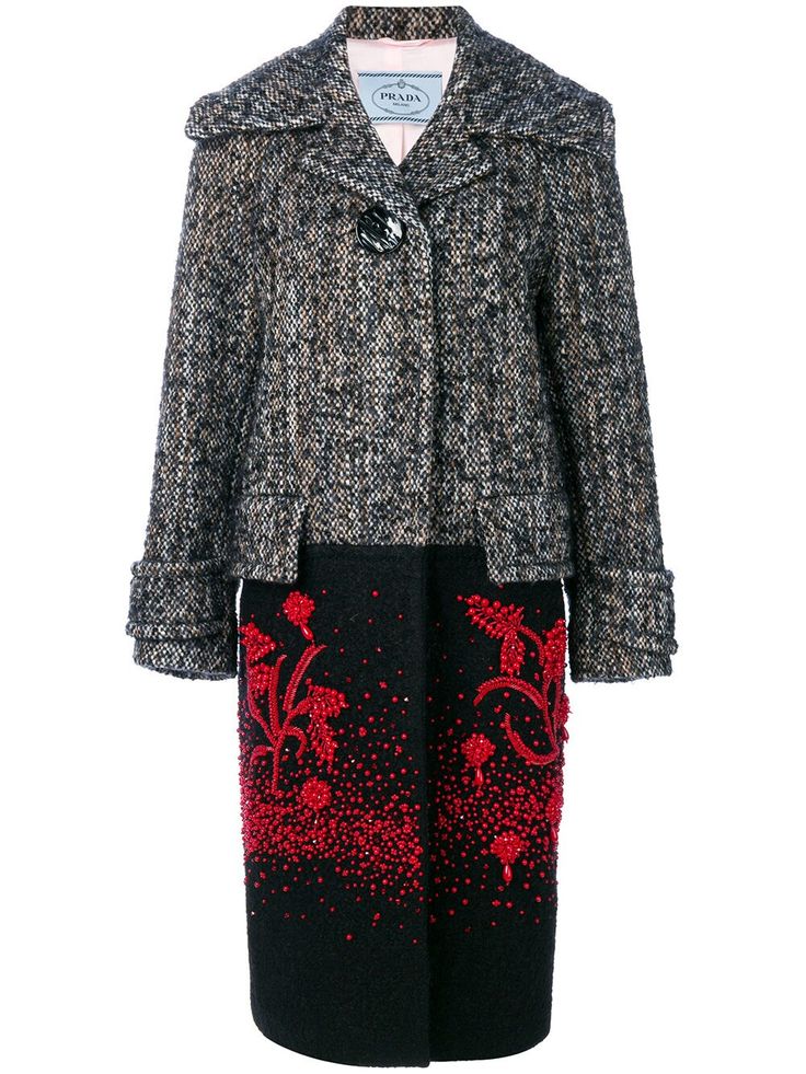 a prada women's coat, featuring a tweed top half in a black and brown pattern, and a black bottom half with red floral and dot embellishments. the coat has a wide collar and a single button closure.