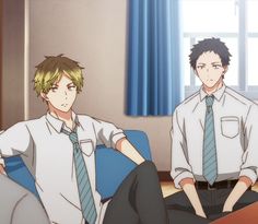 two boys wearing white shirts, blue ties, and black pants are in a room with a window. one boy with blond hair is sitting on a blue couch, while the other one with short black hair is sitting on the floor. they seem to be relaxing and chatting. the room is bright and airy, with sunlight streaming in from the window. the overall atmosphere is calm and peaceful.
