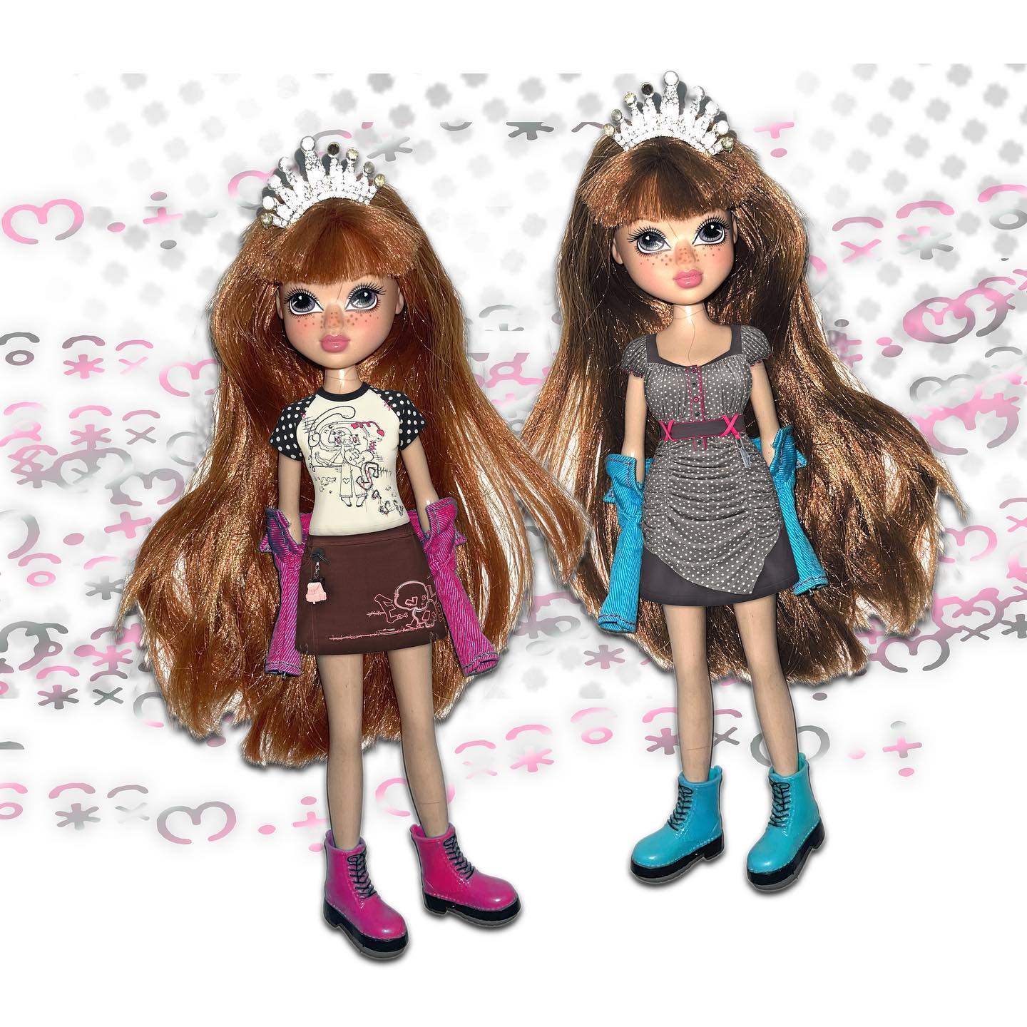 the image shows two bratzstyle dolls positioned sidebyside against a playful, patterned background featuring hearts and stars. both dolls have long, reddishbrown hair, adorned with silver tiaras. they are wearing similar outfits; one has a gray pleated dress and the other a graphic tee and brown skirt, both paired with jackets and contrasting coloured boots. the dolls have similar facial features and are presented in a way that suggests a twin or sisterly connection. they appear to be closeup shots of collectible fashion dolls.