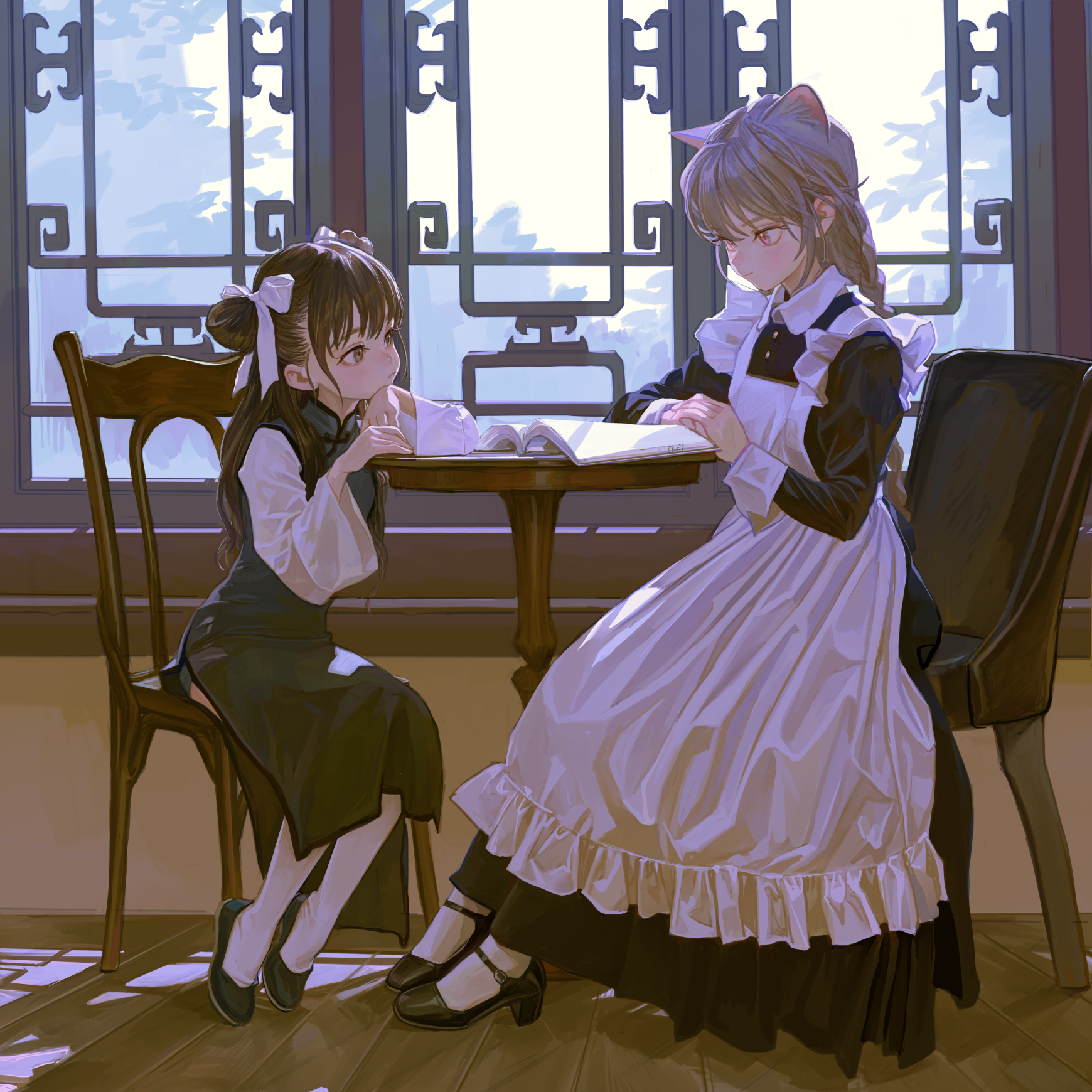 two anime girls are sitting at a table by a window. one is wearing a maid outfit with cat ears and the other is wearing a school uniform. they are both looking at a book on the table.