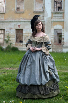 a young woman in a long, gray, antiquestyle gown stands in a grassy area in front of an old, crumbling building. a black raven sits atop her head. she holds her hands together in her lap. the scene is peaceful and evokes a sense of historical romance.