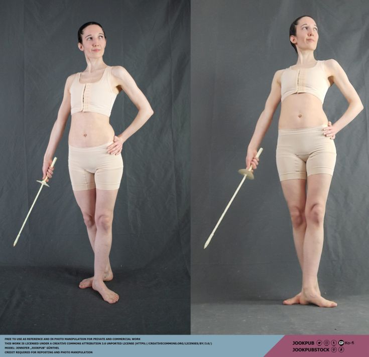 a woman in athletic wear stands holding a fencing sword. she is facing the camera and looking over her left shoulder with a determined expression.  this is a reference photo for artists and creative professionals.