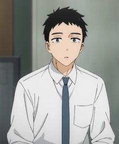 a young, tiredlooking anime boy with short black hair and dark eyes is pictured from the chest up. he is wearing a white buttondown shirt with a dark blue tie. the boy has a slightly sullen expression on his face. the background is a plain gray wall, and the lighting is soft and diffused.