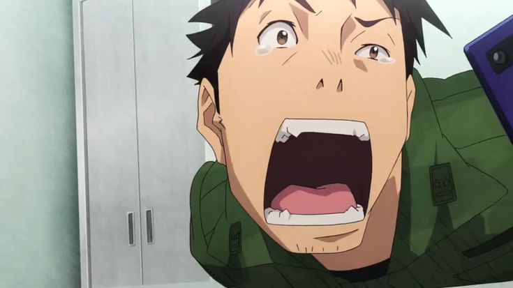 this image is a closeup of an anime character's face. he has his mouth wide open and his eyes are wide with shock and fear. he appears to be surprised and frightened. the background is a blurry image of a white wall.