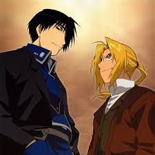 the image showcases a stylized artwork or still from the anime fullmetal alchemist.  it features two prominent characters,  edward elric (the blond character on the right) and roy mustang (the darkhaired character on the left), standing sidebyside,  with their bodies angled slightly towards each other.  edward's spiky blond hair and determined expression contrast with roy's more serious, contemplative demeanor.  the background is a muted yelloworange, evocative of a sunset or sunrise. the art style is consistent with the anime's distinctive character designs and coloring.  the overall mood is serious and suggestive of a pivotal moment in their relationship or story arc.