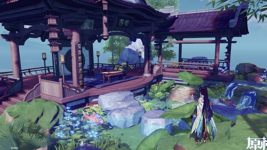 the image is a screenshot from the video game genshin impact. it depicts a serene and peaceful outdoor scene featuring a beautifully detailed gazebo with traditional chinese architecture. the gazebo is situated in a lush garden with various plants, blue flowers, and a small waterfall. koi fish are visible in a pond near the gazebo. a female character, styled in anime fashion, stands in the foreground, observing the scene. the overall atmosphere is tranquil and visually appealing. the lighting and color palette create a sense of calm and fantasy.