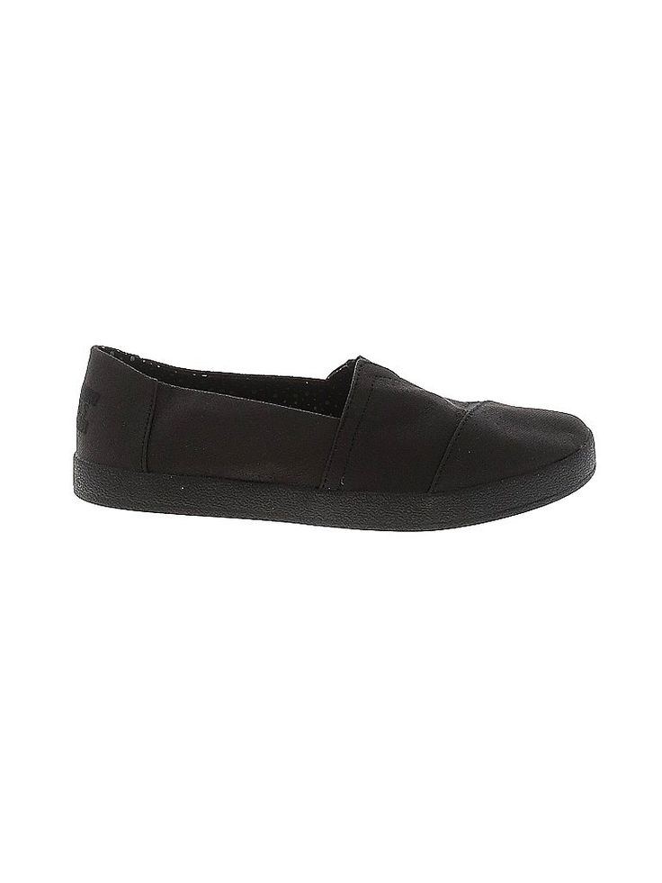 a single black slipon shoe is displayed against a white background. the shoe appears to be made of a soft, flexible material, and has a simple, minimalist design.