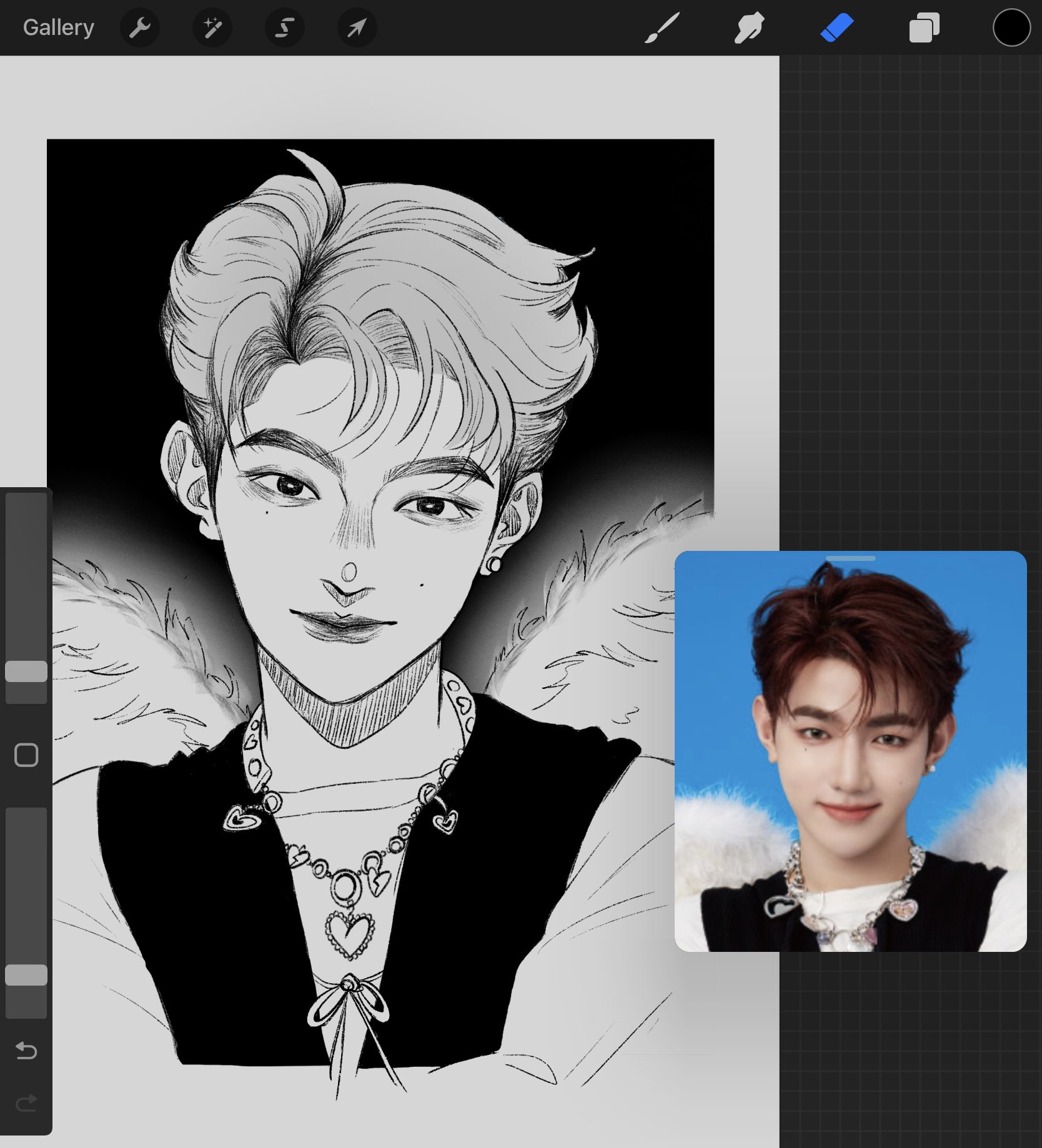 a digital black and white illustration of a male idol. the illustration is a portrait of the idol, who is wearing a black outfit with a white feather boa and a necklace. the illustration is drawn in a mangainspired style. a smaller color image of the idol in the same pose and attire is positioned to the lower right of the illustration and provides the color reference for the drawing. the background of the illustration is black, while the background of the reference photo is blue.