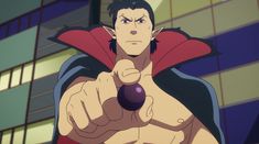: a cartoon vampire in a red cape points directly at the viewer, holding a small, dark purple orb in his hand.  the setting is a city at night, lit by bright, artificial lights.