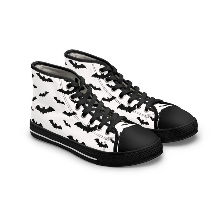 the image shows a pair of hightop canvas sneakers.  the shoes are predominantly white with a repeating pattern of black bat silhouettes across the entire surface. the laces and the toe cap are black. the shoes are positioned slightly angled, with one shoe slightly behind the other, to showcase both sides. the background is pure white, making the shoes stand out clearly.  the overall style is casual, potentially geared towards a halloween or gothic aesthetic.