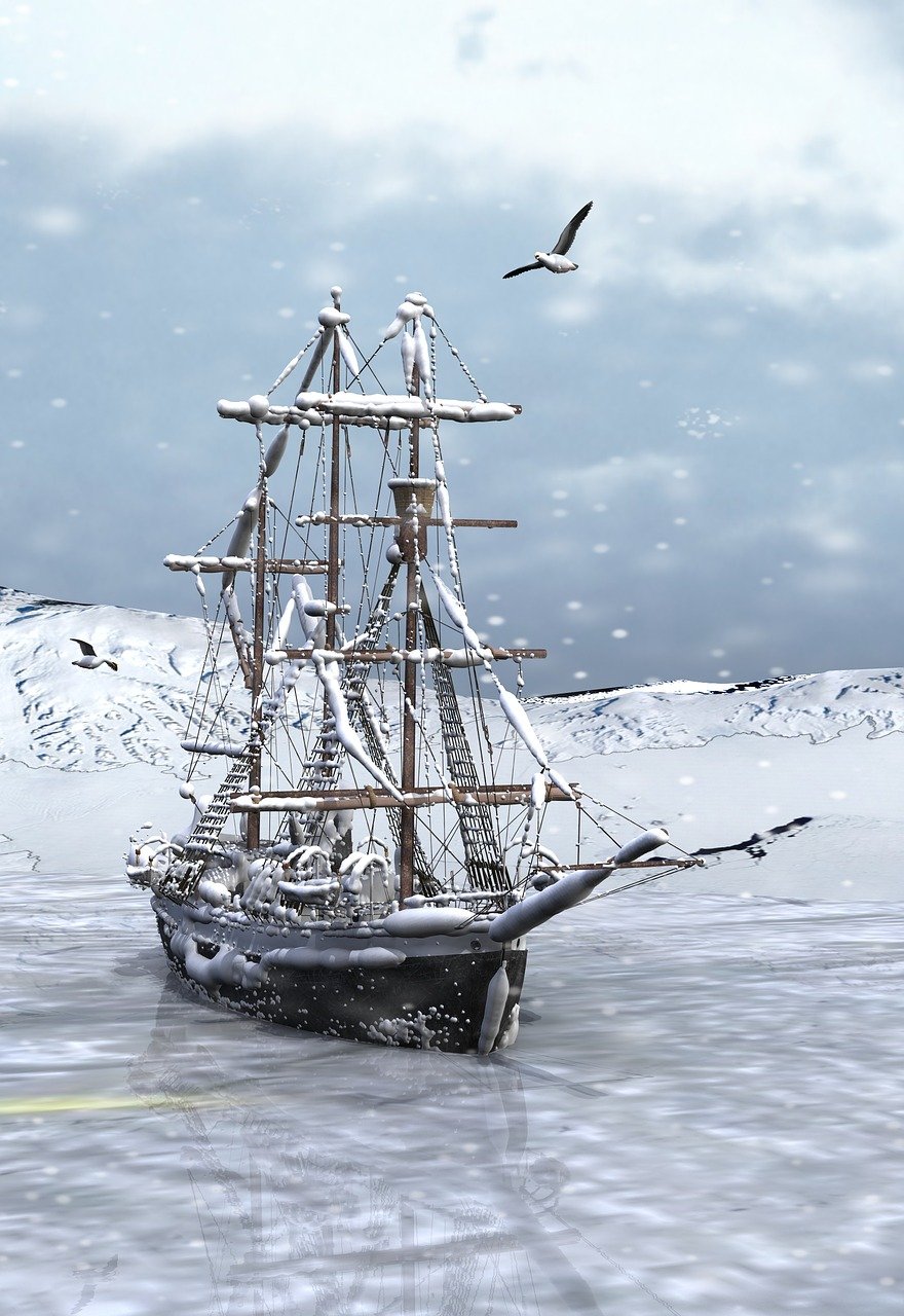 a snowcovered sailboat is stuck in ice, with snowy mountains in the background and two birds flying in the sky.