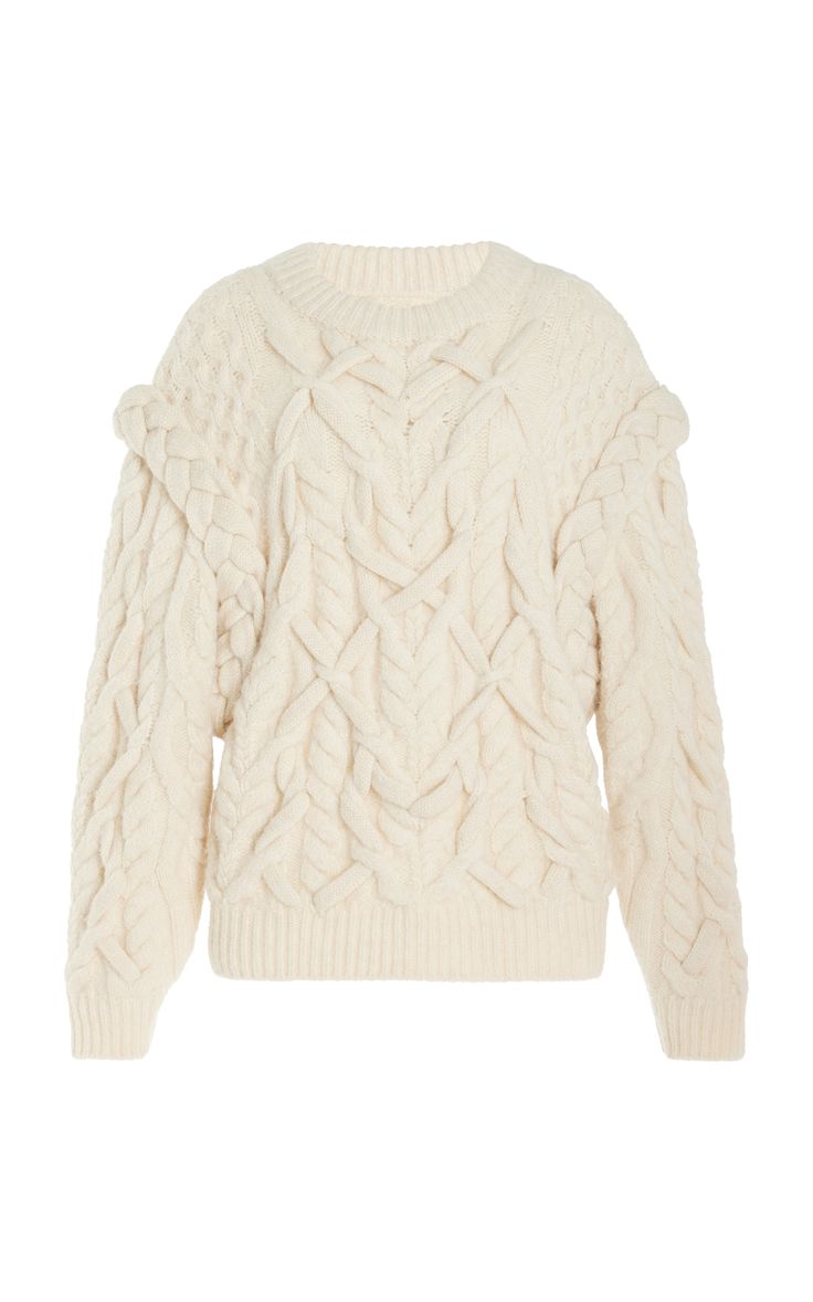 a closeup of a white cableknit sweater with a relaxed fit and a chunky knit texture.  it is a cozy and comfortable sweater perfect for the cold winter months.