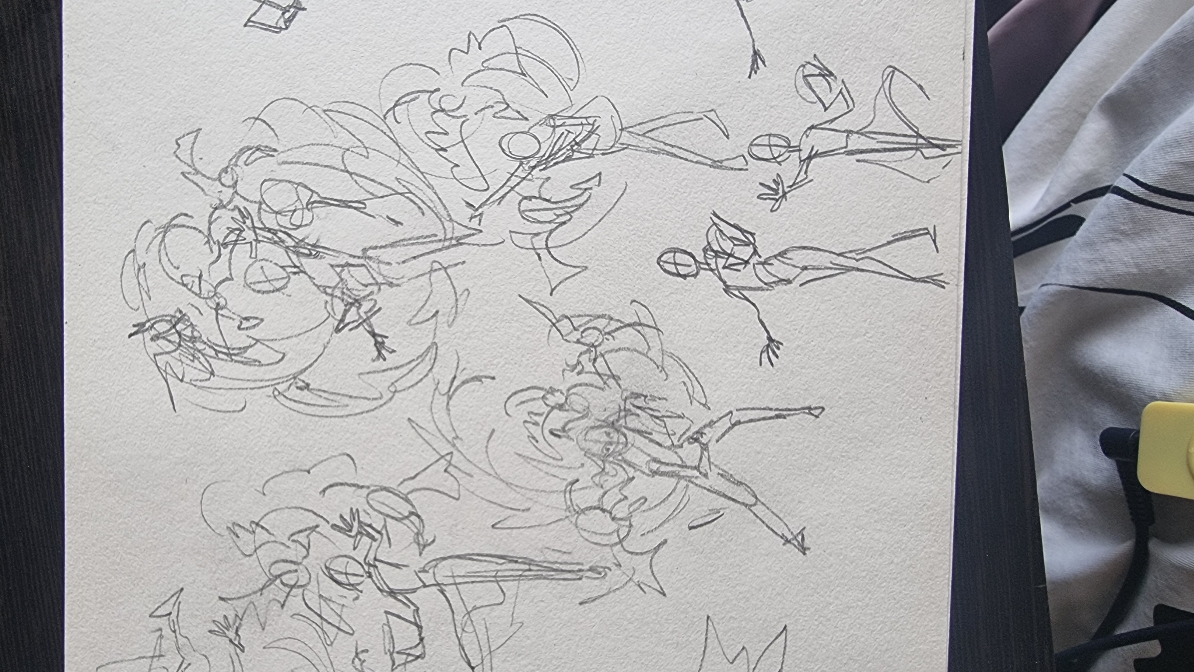 the image showcases a series of dynamic figure sketches on a light gray paper, likely drawn with a graphite pencil. the figures are captured in various action poses, some wielding weapons or surrounded by swirling energy effects, suggesting a scene of combat or intense movement. the artist prioritizes capturing motion and energy over fine detail, using loose, flowing lines to convey dynamism.