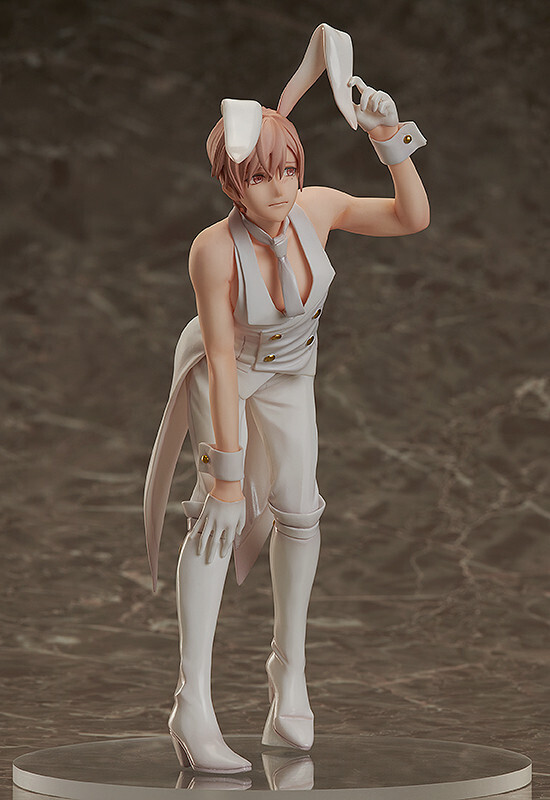 he image shows a closeup view of an anime figurine of a male character dressed in a white bunny girl costume. the figurine is meticulously detailed, showcasing the character's pose, outfit, and accessories. the character has light pink hair and is wearing a white tailcoat, white gloves, and tall white boots. the bunny ears are perched atop his head. the background is a marblelike surface that subtly complements the figurine's color scheme. the overall impression is one of elegance and sophistication.