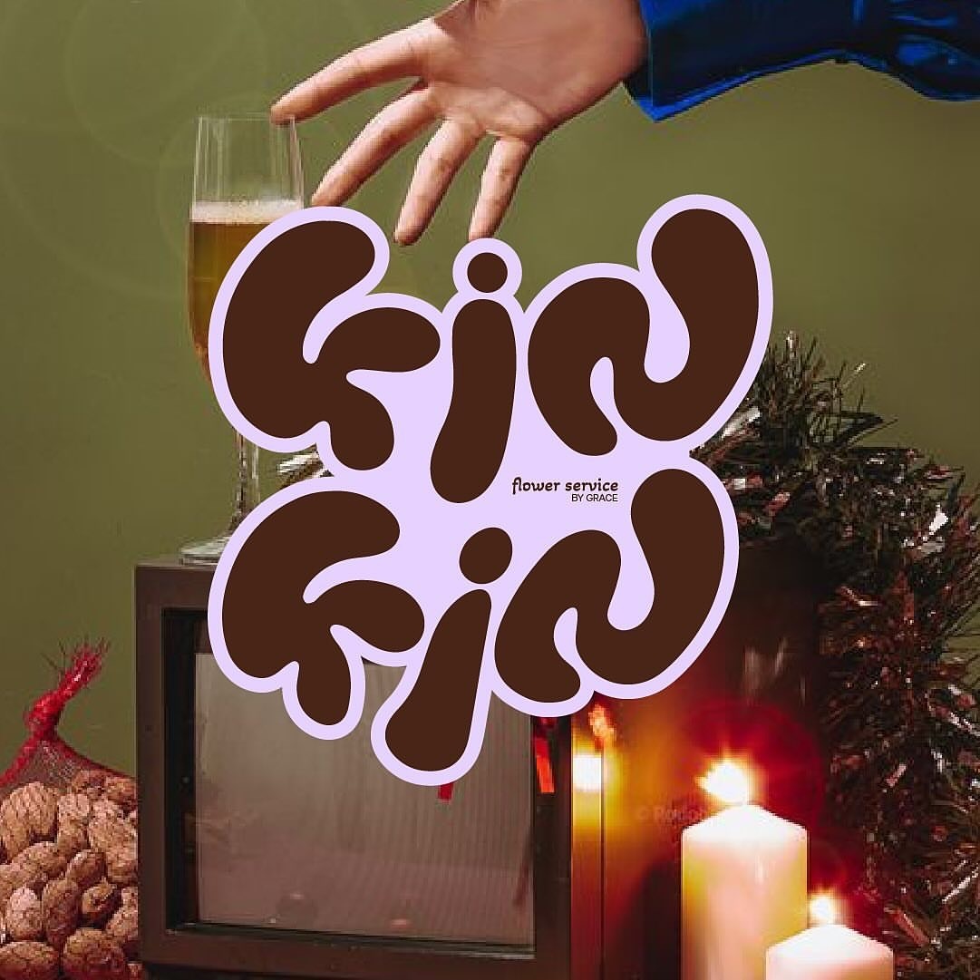 a hand reaches for a glass of champagne in front of a vintage television set. warm candlelight illuminates the scene, accented by a bowl of ornaments in the foreground.  the text "gin gin" is overlaid on the image in a retro font, with "flower service by grace" appearing in smaller text below. the overall aesthetic suggests a cozy and festive atmosphere, hinting at a new year's eve or christmas eve celebration.