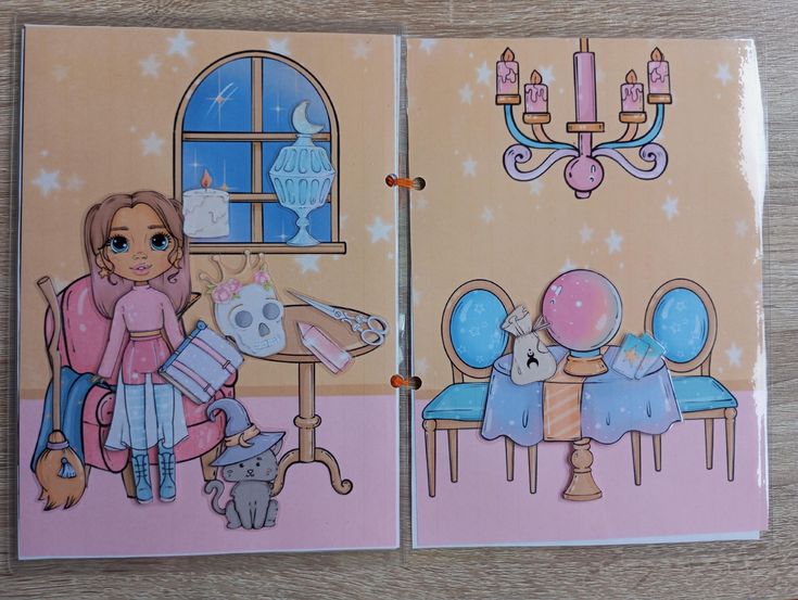 a paper doll scrapbook page. on the left is a witch doll next to a chair, a cat wearing a witch hat, a broom, a table with a skull and other objects. on the right is a table with a crystal ball and tarot cards, with chairs and a chandelier above.