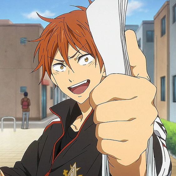 the image shows a closeup portrait of a young anime man with vibrant orange hair and brown eyes. he is smiling broadly with an enthusiastic expression, holding a stack of papers in his left hand and giving a thumbsup with his right. he wears a black and red athleticstyle jacket with gold details, suggesting a school uniform. the background depicts a typical city street scene with buildings and sidewalks, bathed in bright sunlight. the overall impression is one of energy, excitement, and positive accomplishment.