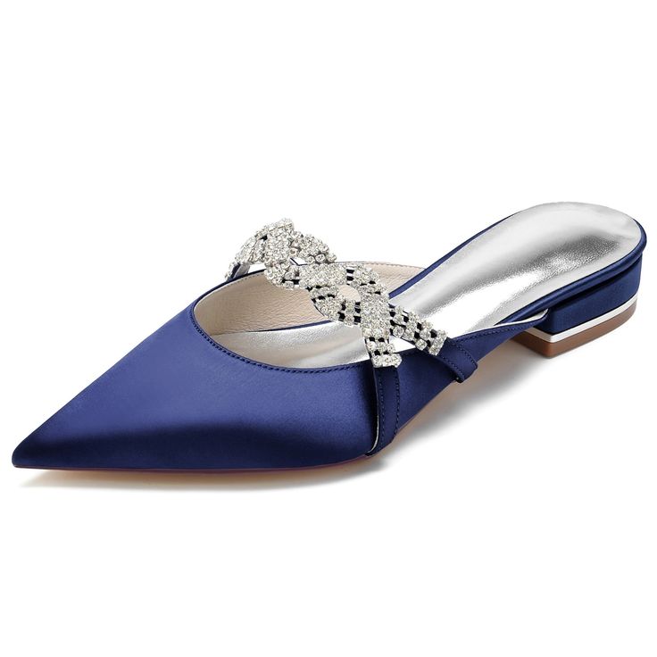 a pair of women's blue satin heeled mules with a pointed toe and a rhinestone embellishment. the shoes are perfect for a wedding or other formal occasion. they are elegant and stylish.