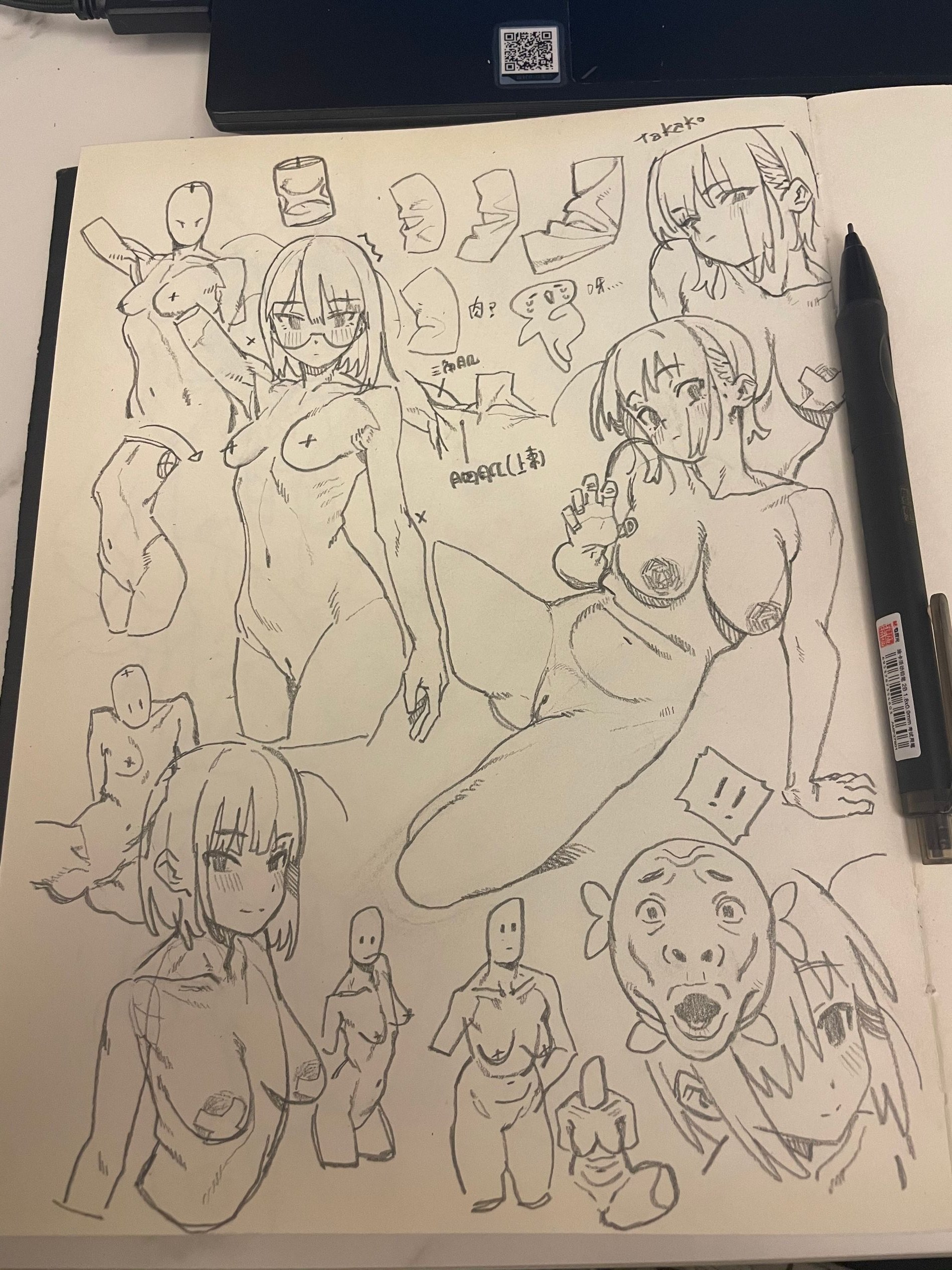 a page from a sketchbook filled with pencil sketches, predominantly featuring nude female figures in various poses. there are also studies of folded fabric, facial expressions, and anatomical sketches. a black pen rests on the right side of the page.