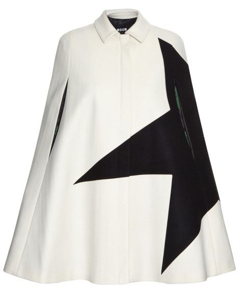 a white cape with a black geometric design on one side, featuring a collared neckline and an oversized fit.